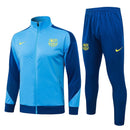 Offizieller FC Barcelona Trainingsanzug 25/26 Jacke und Hose in Blau, Ansicht von vorne.