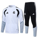 Real Madrid Trainingsanzug 26/27 Jacke Weiß und Hose Schwarz - SHOP DES SPIELERS